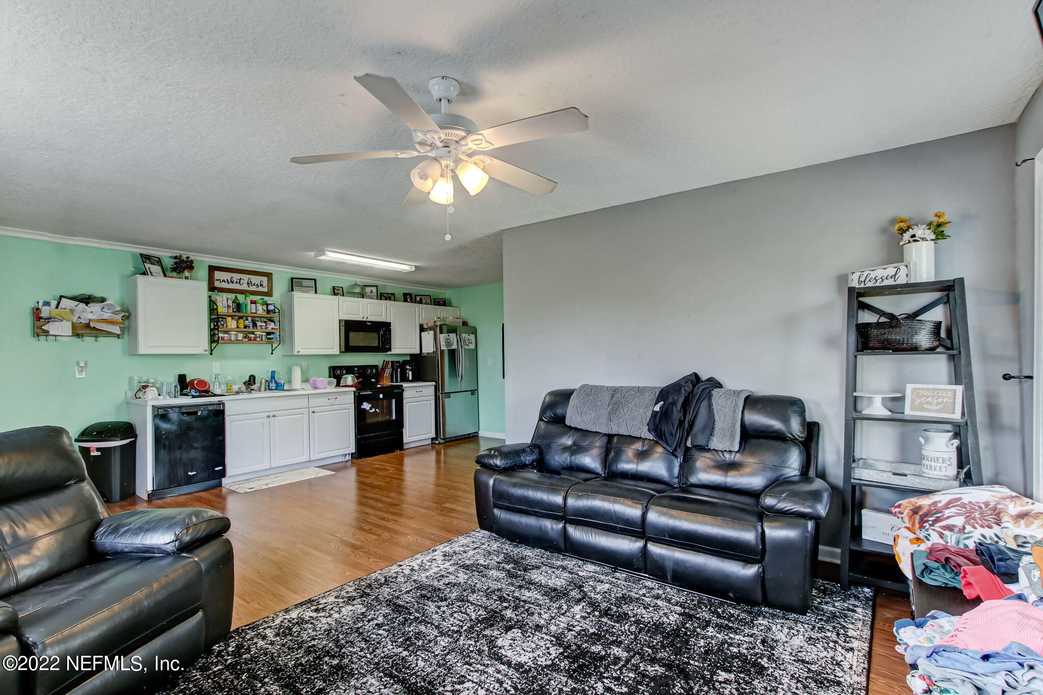 75004 Edwards Road Yulee, FL 32097 - Photo 39 of 62 a living room with furniture and wooden floor