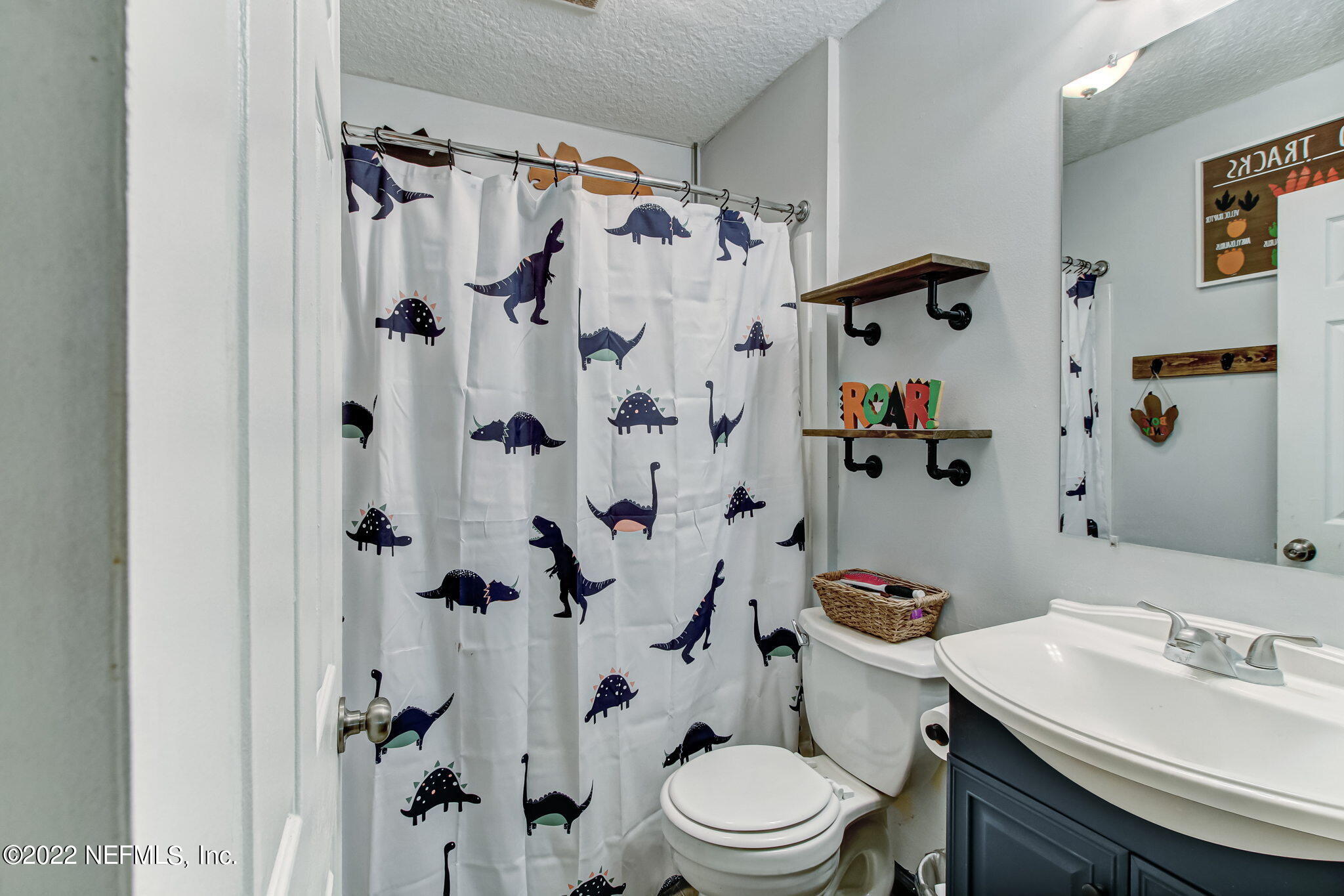 75004 Edwards Road Yulee, FL 32097 - Photo 50 of 62 a bathroom with a sink toilet and shower