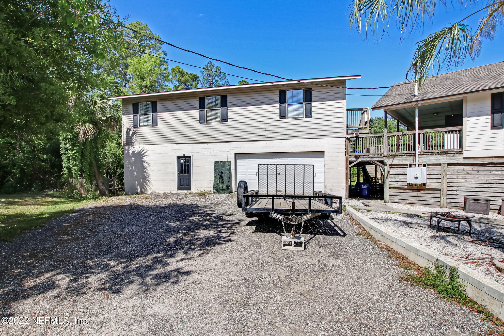 75004 Edwards Road Yulee, FL 32097 - Photo 5 of 62 a view of a house with backyard and sitting area