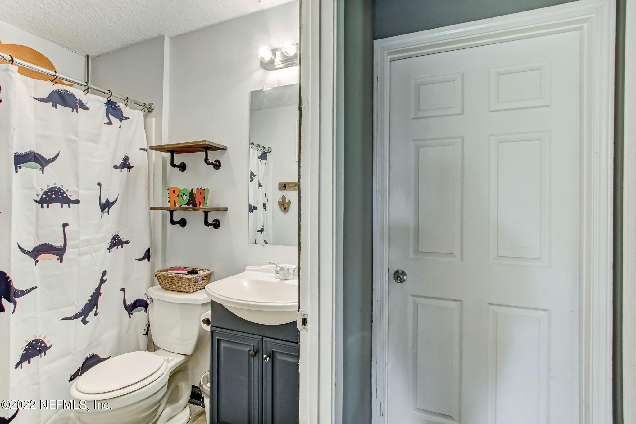 75004 Edwards Road Yulee, FL 32097 - Photo 51 of 62 a bathroom with a sink toilet vanity and shower