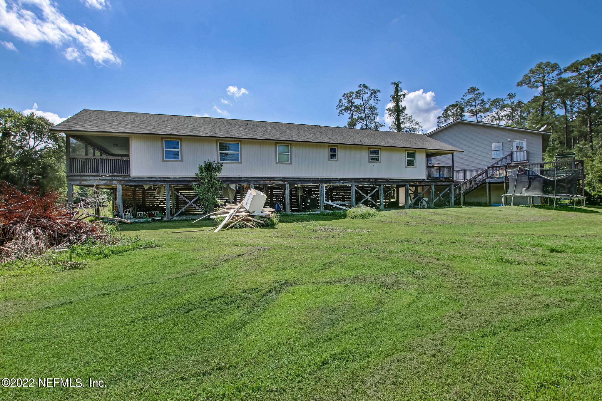 75004 Edwards Road Yulee, FL 32097 - Photo 52 of 62 a view of a house with a yard porch and sitting area