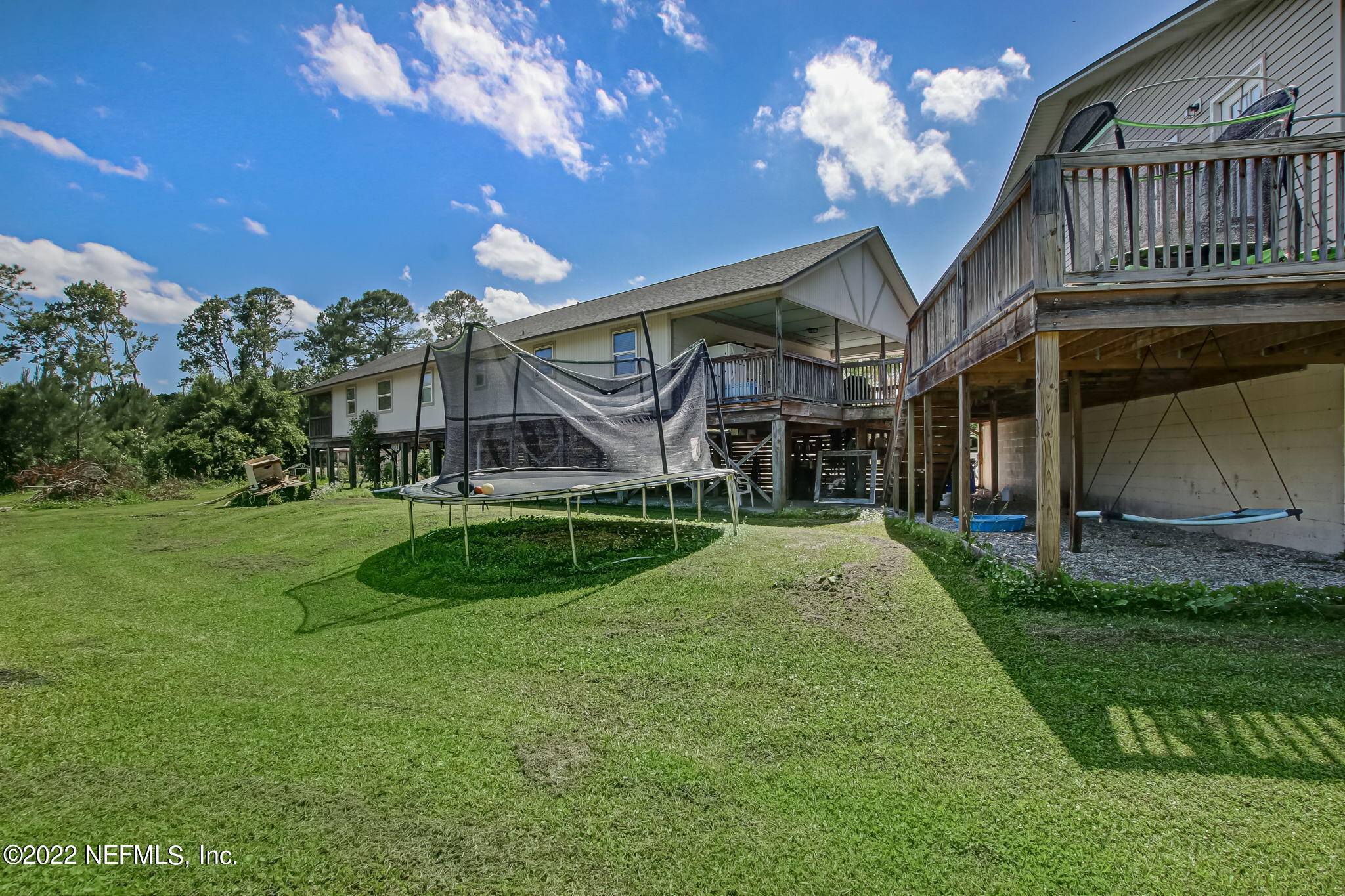 75004 Edwards Road Yulee, FL 32097 - Photo 53 of 62 a view of a house with a yard