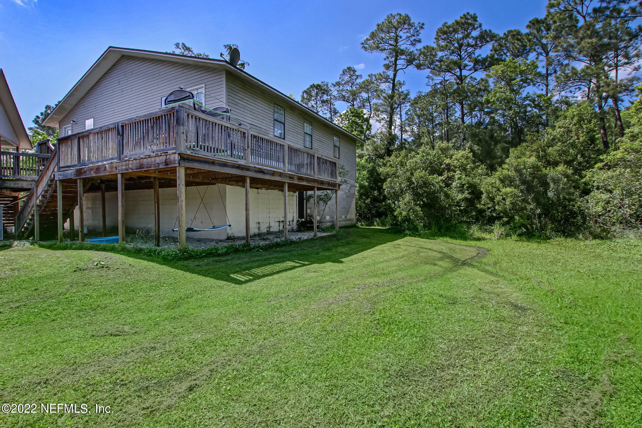 75004 Edwards Road Yulee, FL 32097 - Photo 56 of 62 a view of a house with yard and a garden