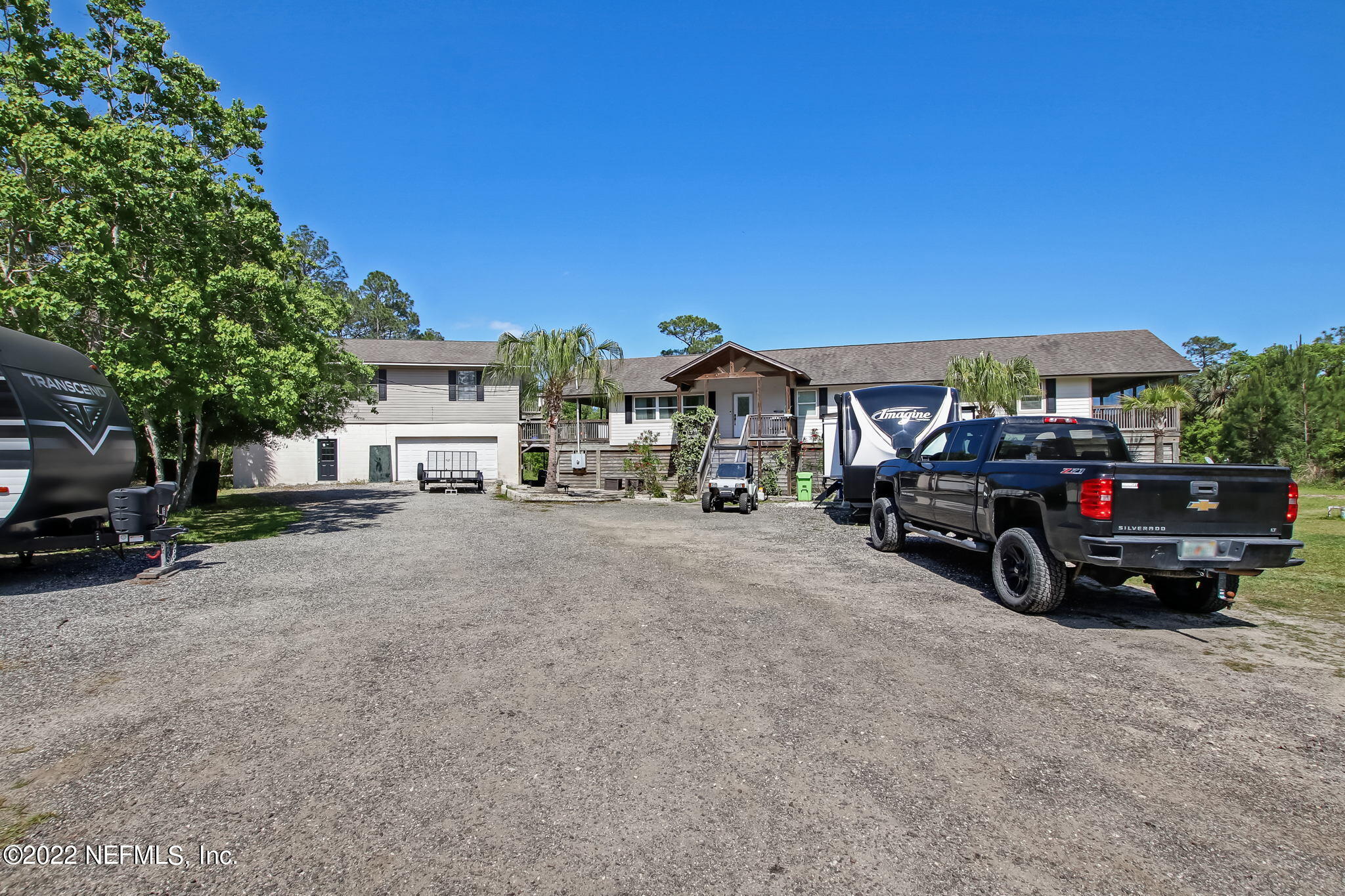 75004 Edwards Road Yulee, FL 32097 - Photo 6 of 62 a view of a cars park in front of house