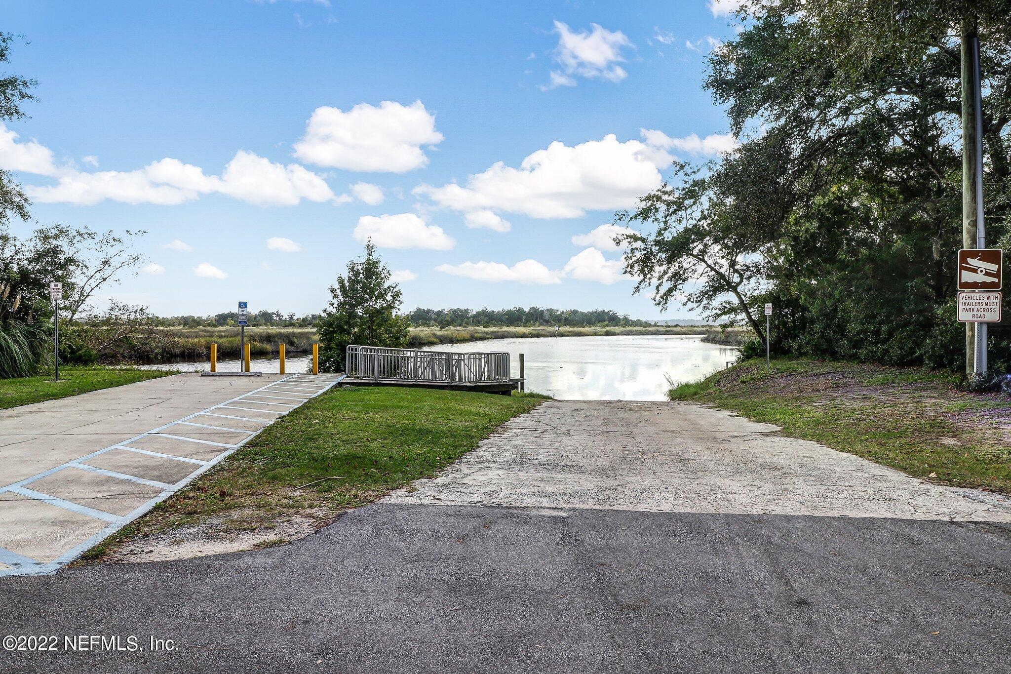 75004 Edwards Road Yulee, FL 32097 - Photo 61 of 62 a view of a garden with a building in the background