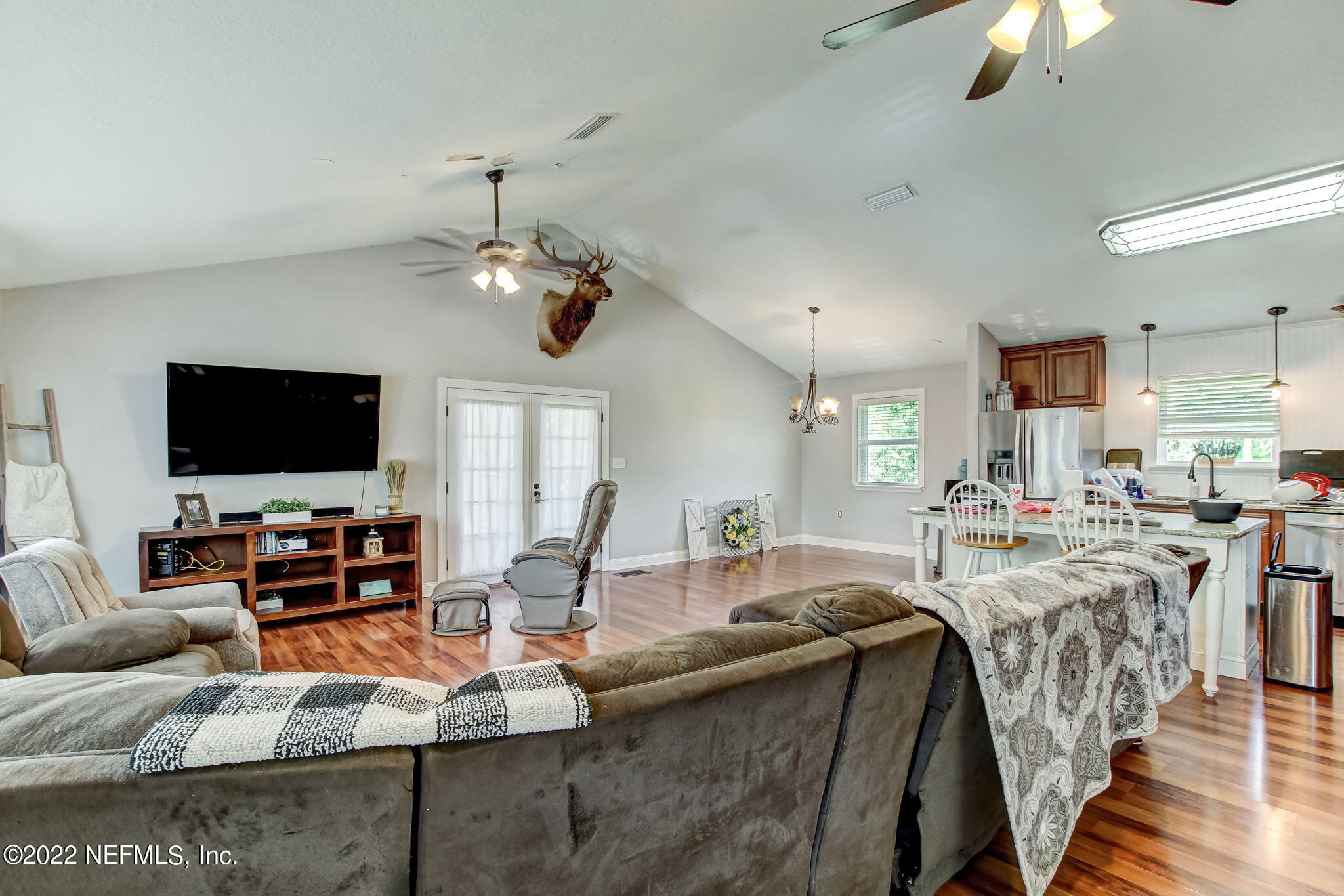 75004 Edwards Road Yulee, FL 32097 - Photo 10 of 62 a living room with fireplace furniture and a flat screen tv