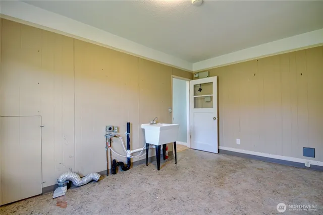 a view of a room with furniture and windows