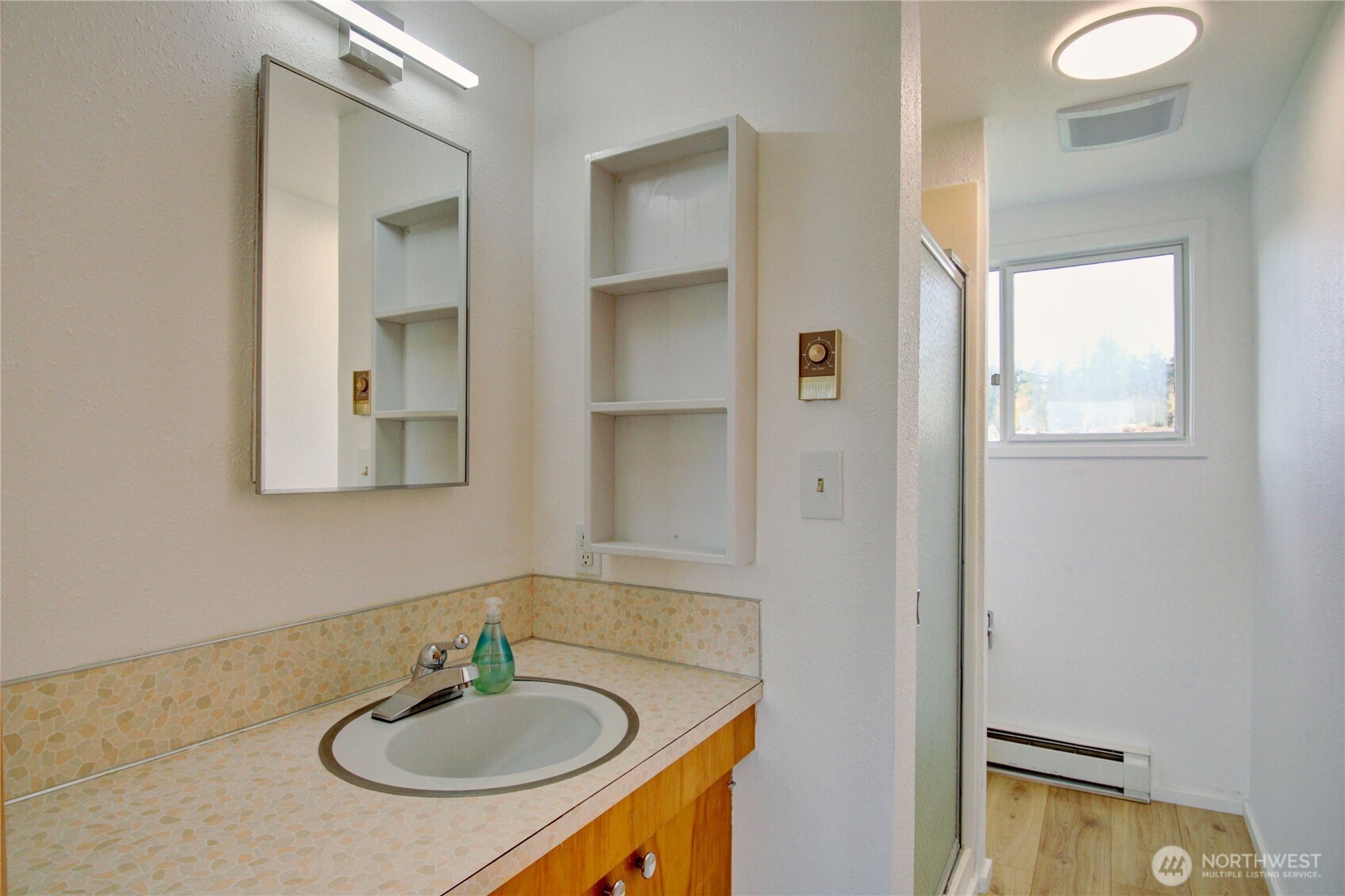 18122 Best Road Mount Vernon, WA 98273 - Photo 25 of 40 a bathroom with a sink and a mirror