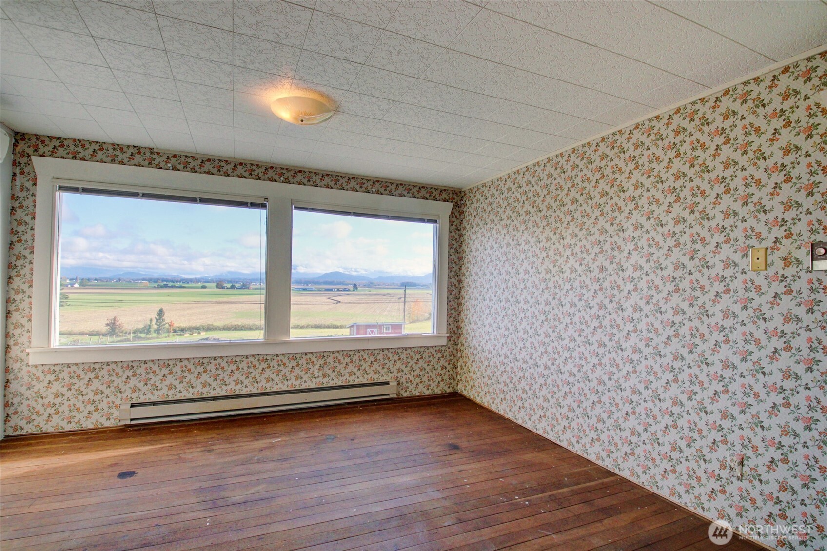 18122 Best Road Mount Vernon, WA 98273 - Photo 30 of 40 a view of an empty room with wooden floor and a window