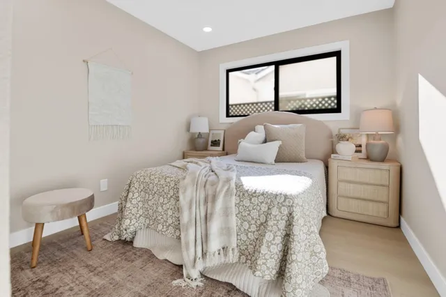 a bedroom with a bed and a view of bathroom