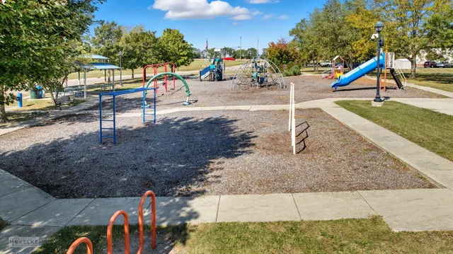 a view of a park with swings