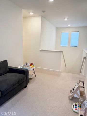 a bedroom with a bed and cabinets