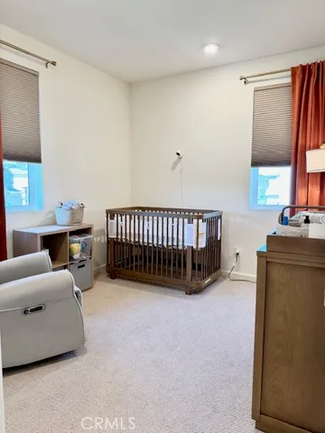 a bed room with a bed and a couch