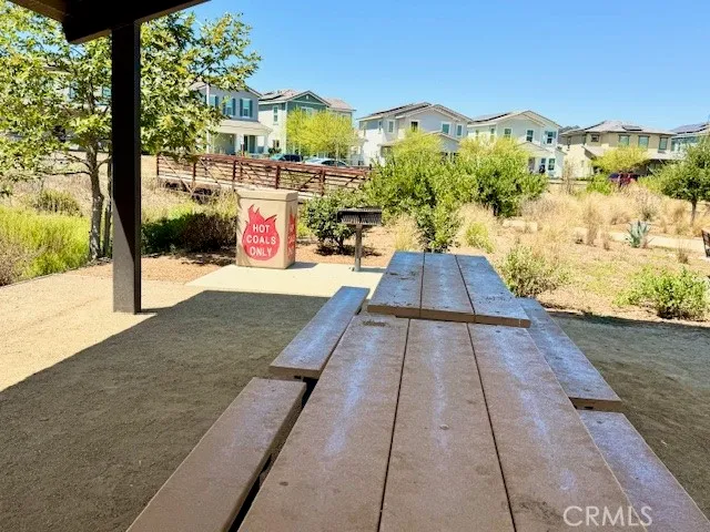 a swimming pool view with a large garden