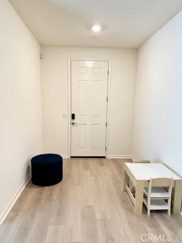 a room with a bed and a cabinet