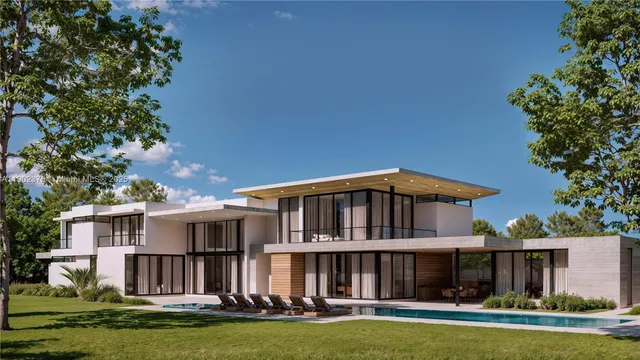 a front view of a house with a yard table and chairs