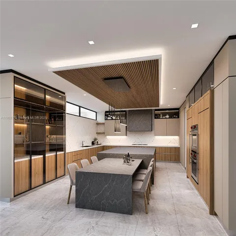 a kitchen with stainless steel appliances kitchen island granite countertop a refrigerator and a stove