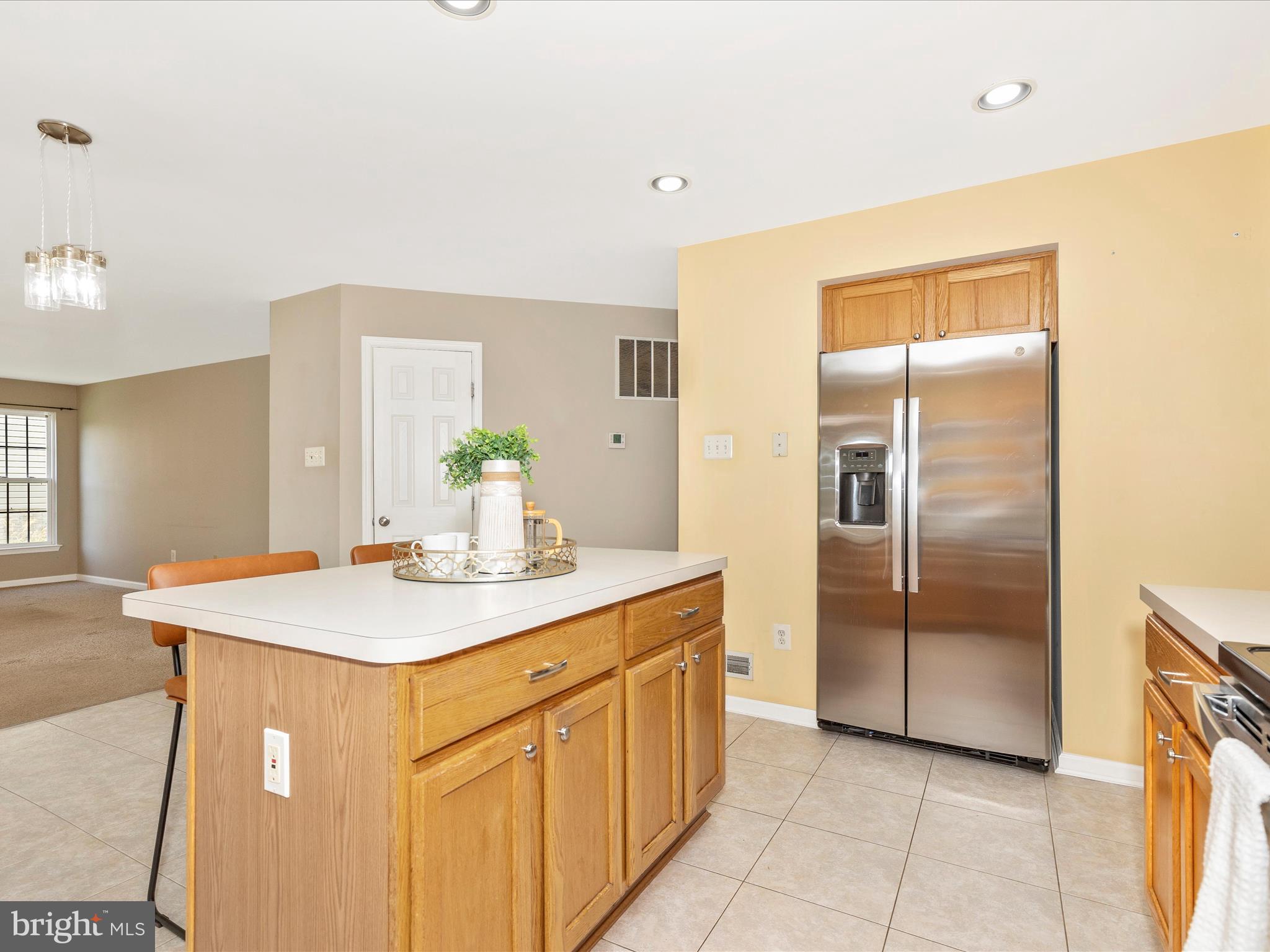 1402 Marian Way Mount Airy, MD 21771 - Photo 14 of 66 a kitchen with a sink and refrigerator