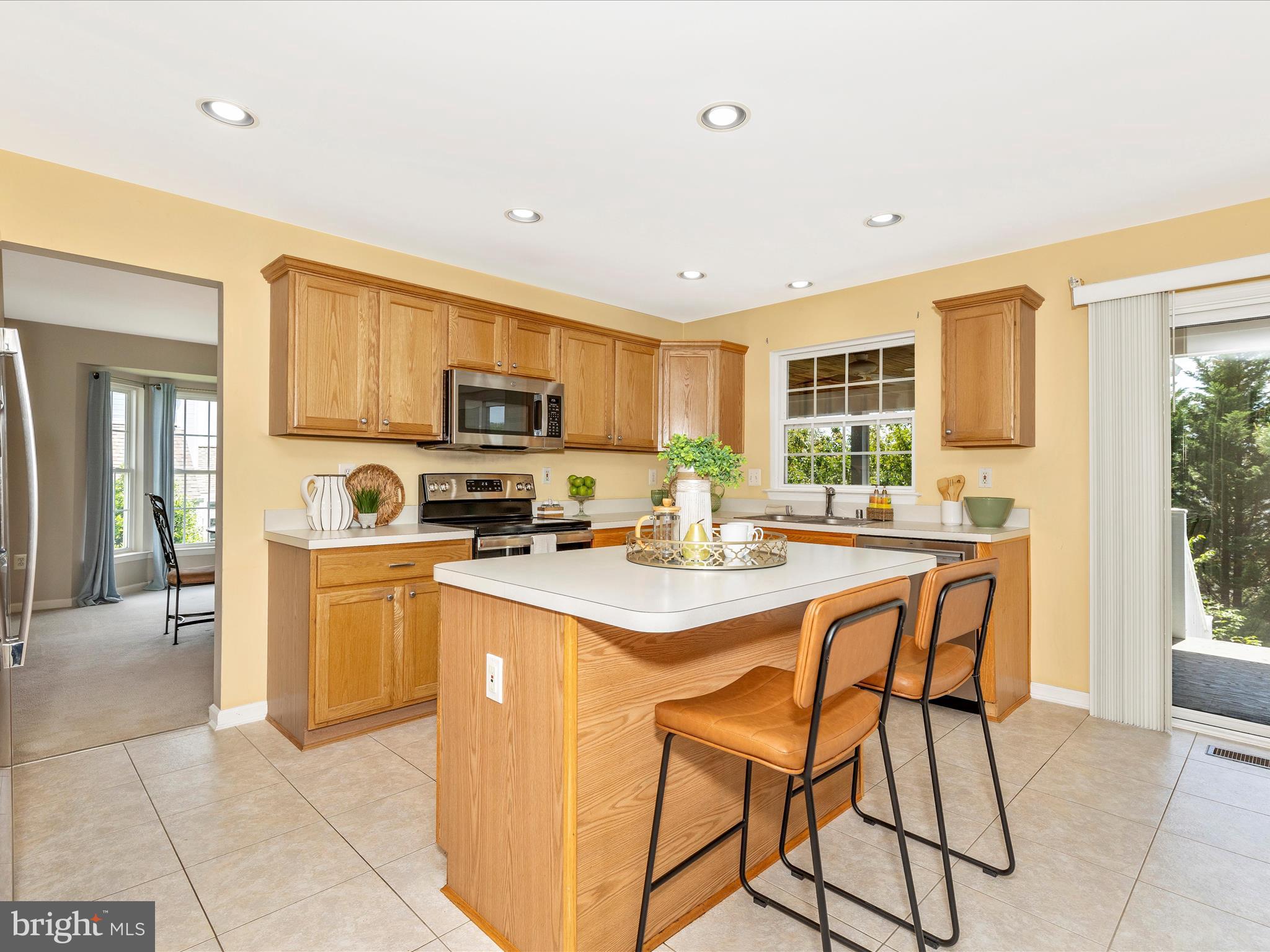 1402 Marian Way Mount Airy, MD 21771 - Photo 17 of 66 a kitchen with stainless steel appliances kitchen island granite countertop a sink and cabinets