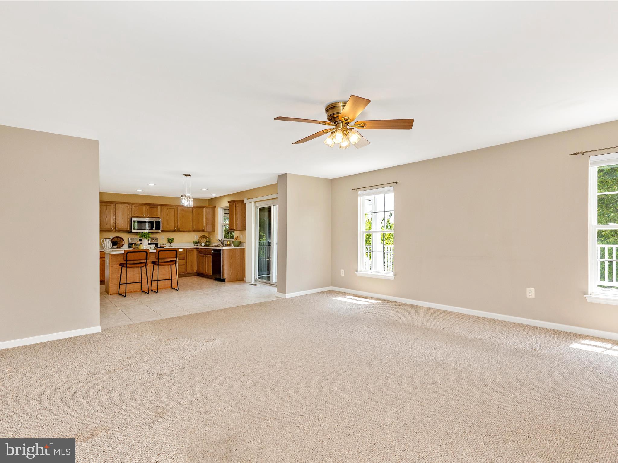1402 Marian Way Mount Airy, MD 21771 - Photo 23 of 66 an empty room with a kitchen view and a window
