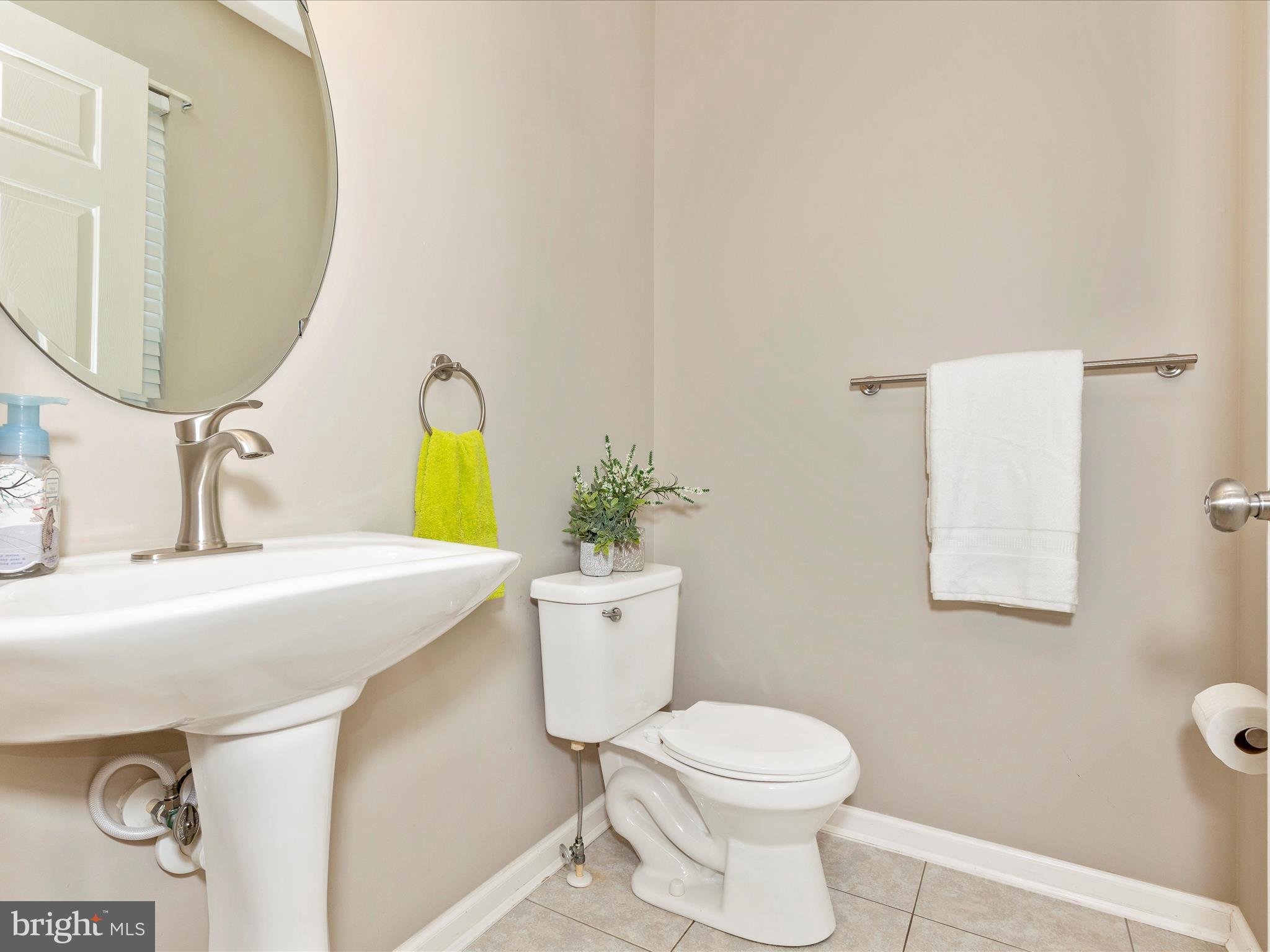 1402 Marian Way Mount Airy, MD 21771 - Photo 25 of 66 a bathroom with a sink mirror vanity and toilet
