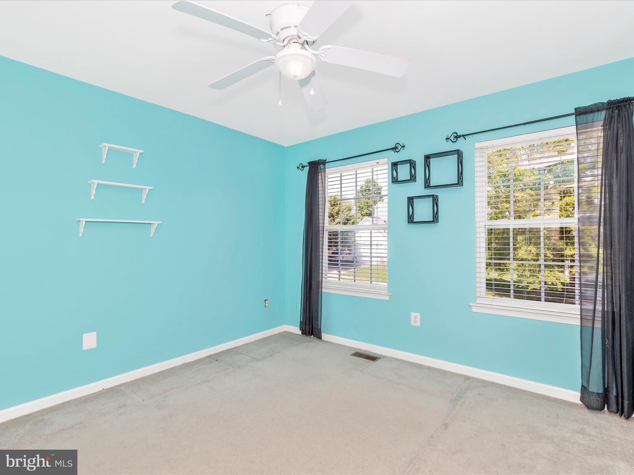 1402 Marian Way Mount Airy, MD 21771 - Photo 34 of 66 an empty room with a window and ceiling fan