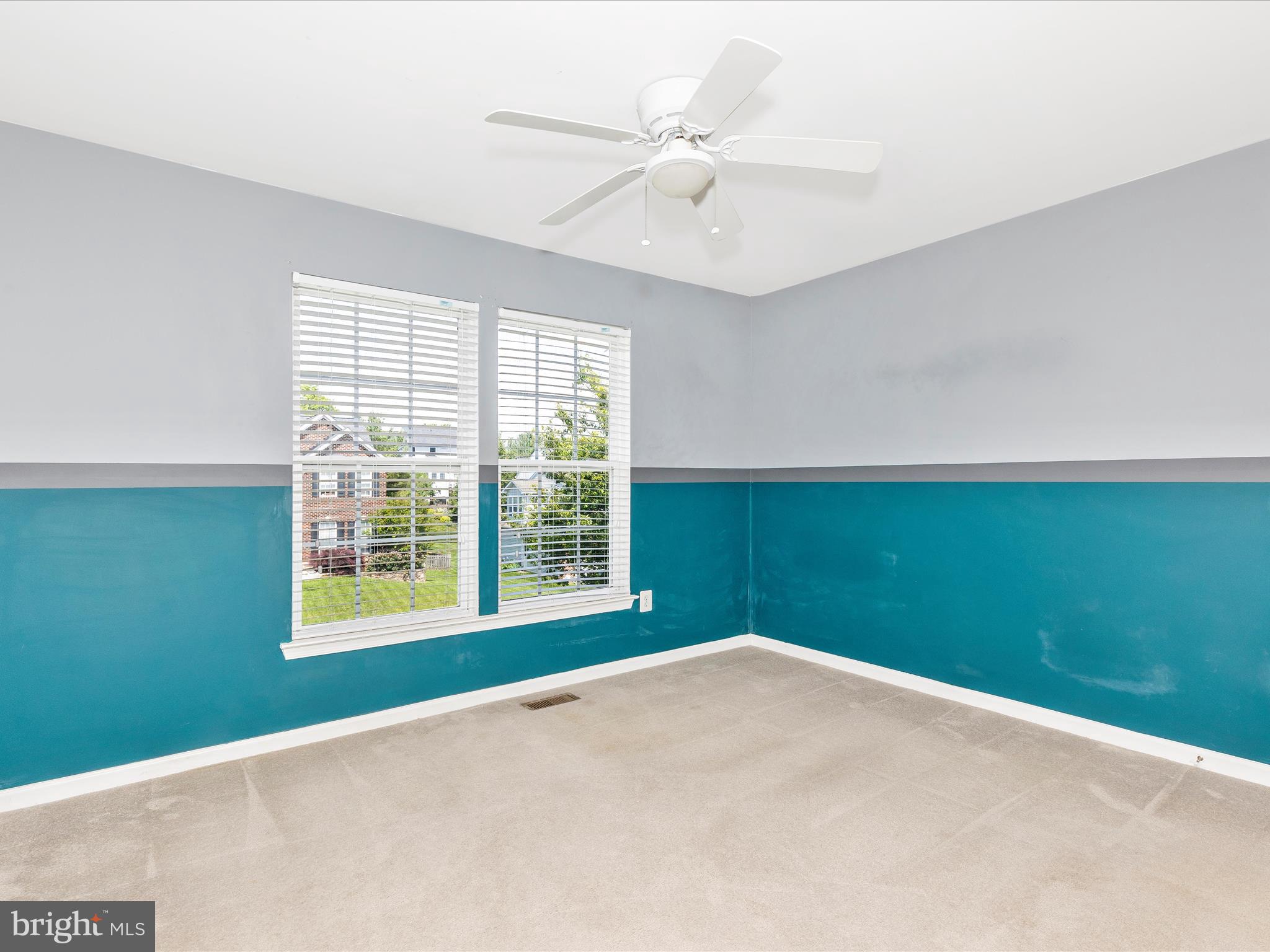 1402 Marian Way Mount Airy, MD 21771 - Photo 37 of 66 an empty room with a window and a ceiling fan