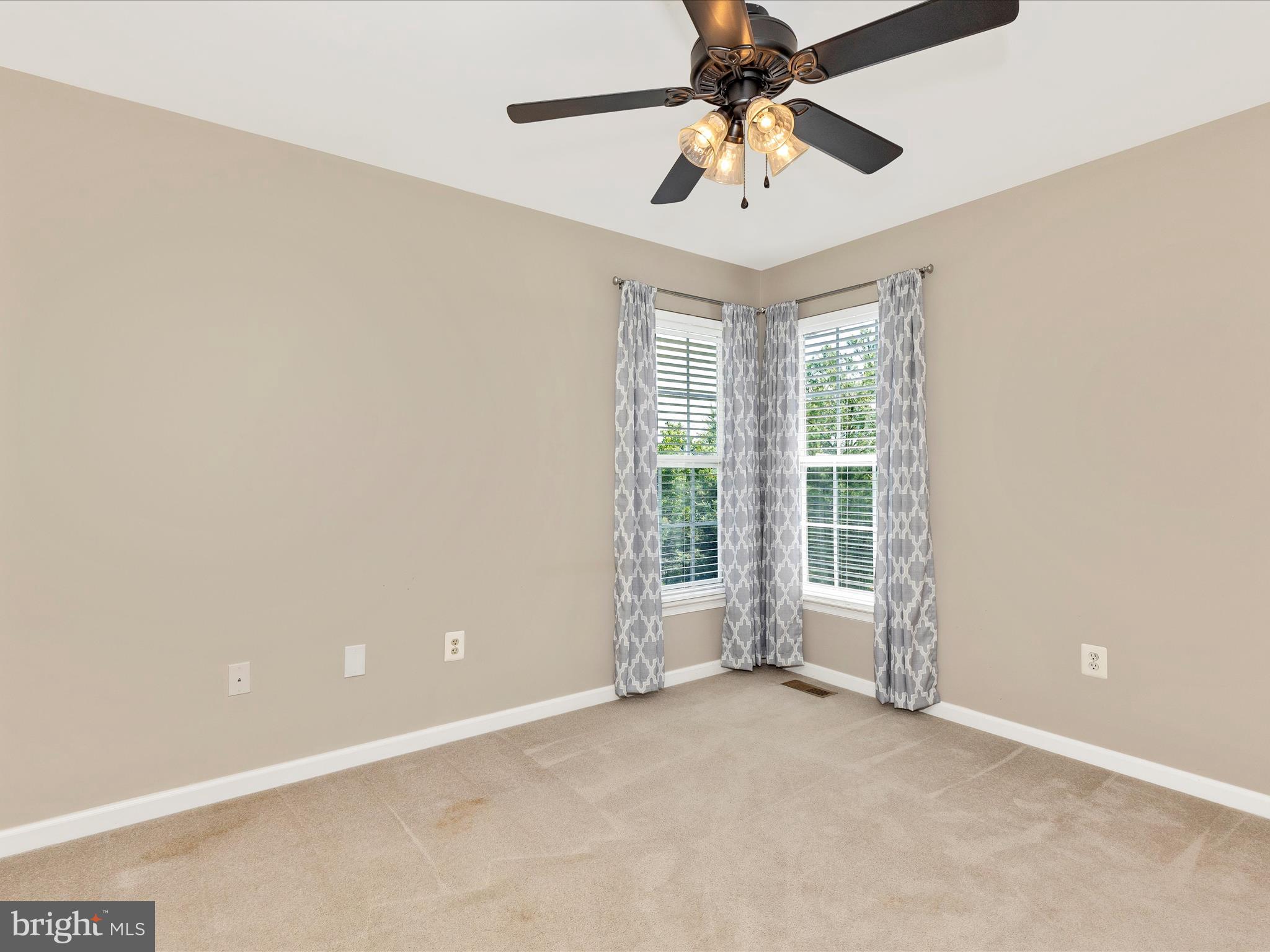 1402 Marian Way Mount Airy, MD 21771 - Photo 39 of 66 an empty room with chandelier fan
