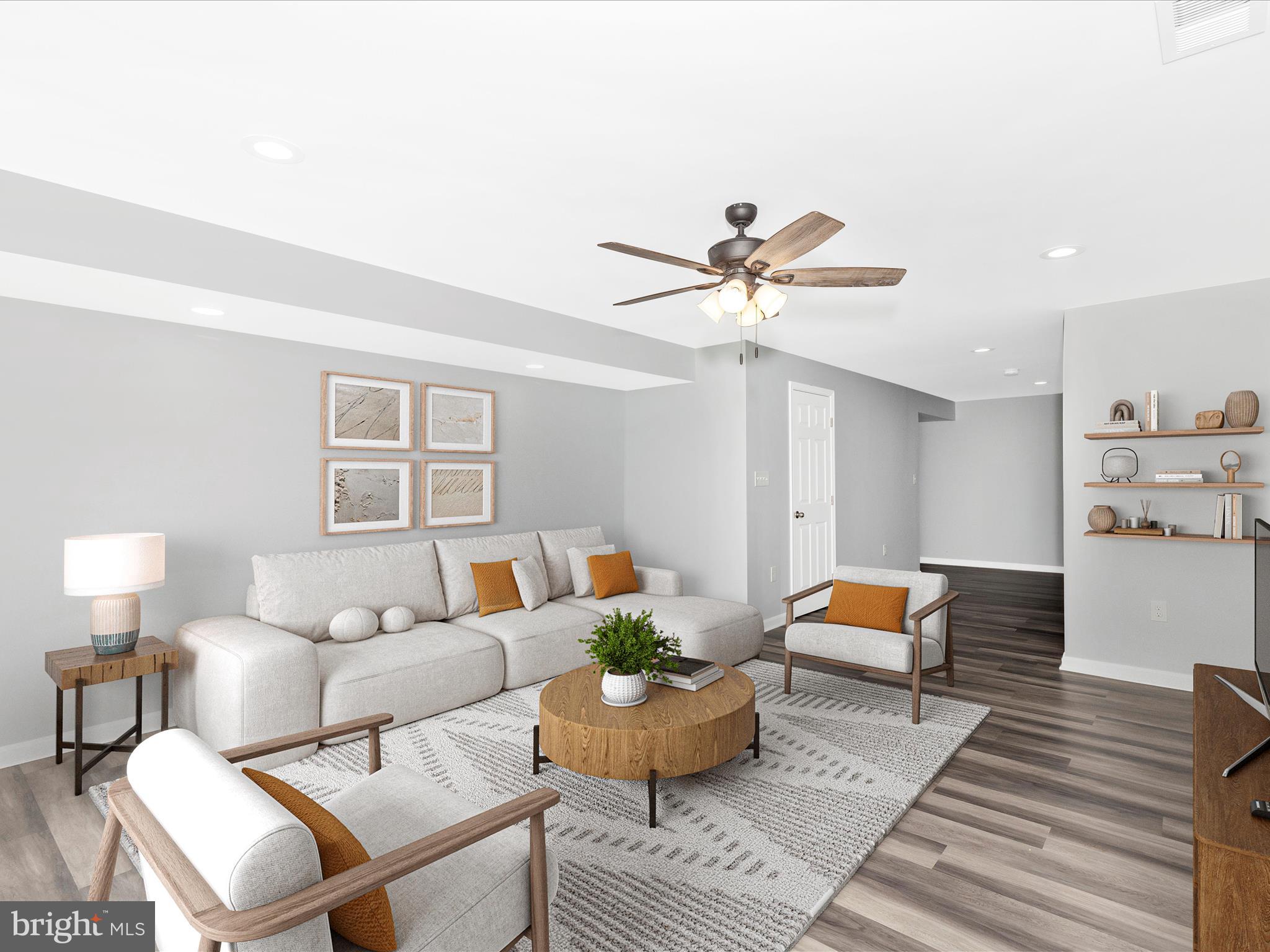 1402 Marian Way Mount Airy, MD 21771 - Photo 43 of 66 a living room with furniture and a wooden floor