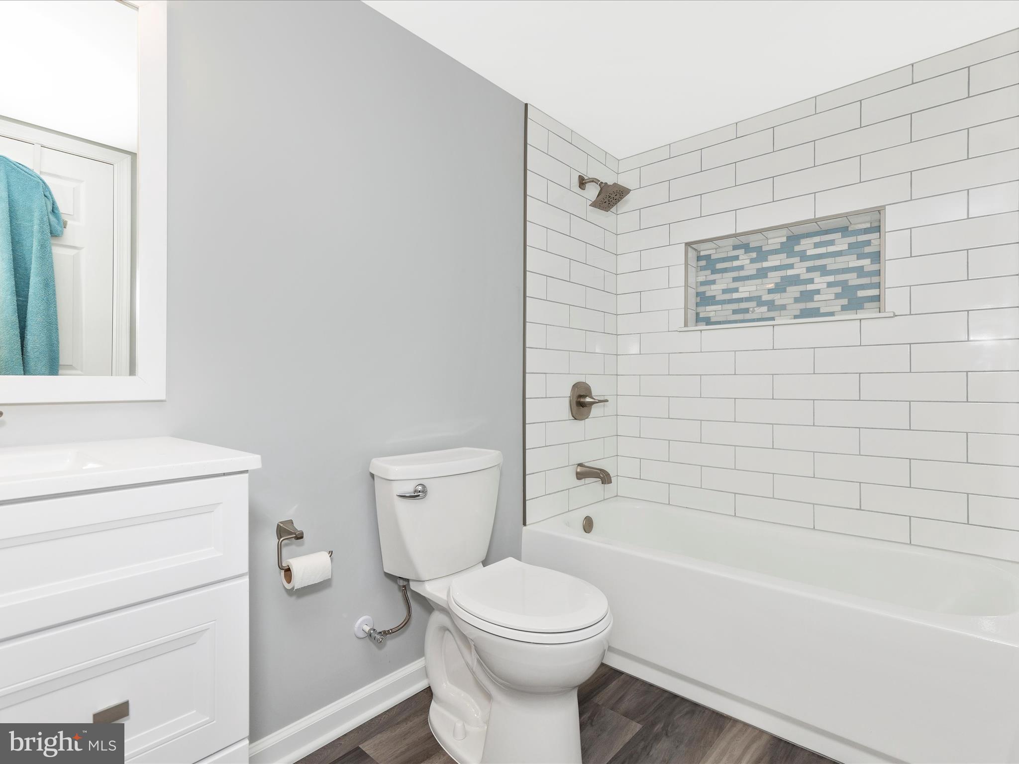 1402 Marian Way Mount Airy, MD 21771 - Photo 46 of 66 a bathroom with a toilet a sink and bathtub