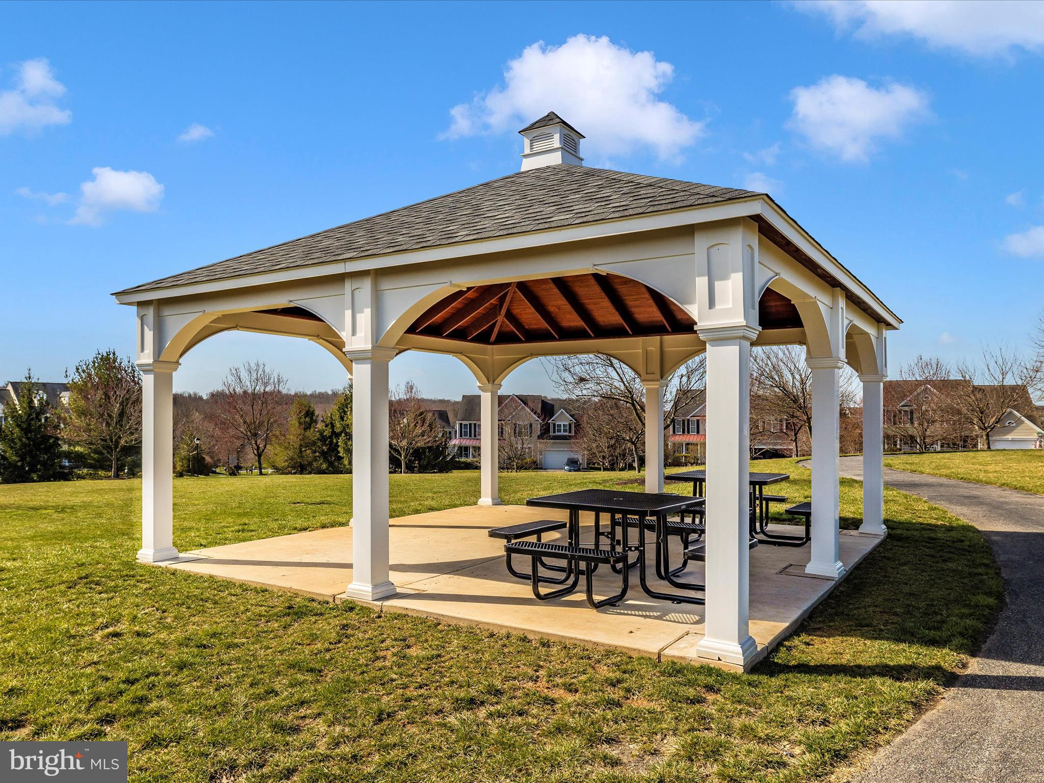 1402 Marian Way Mount Airy, MD 21771 - Photo 57 of 66 a front view of a house with swimming pool and porch