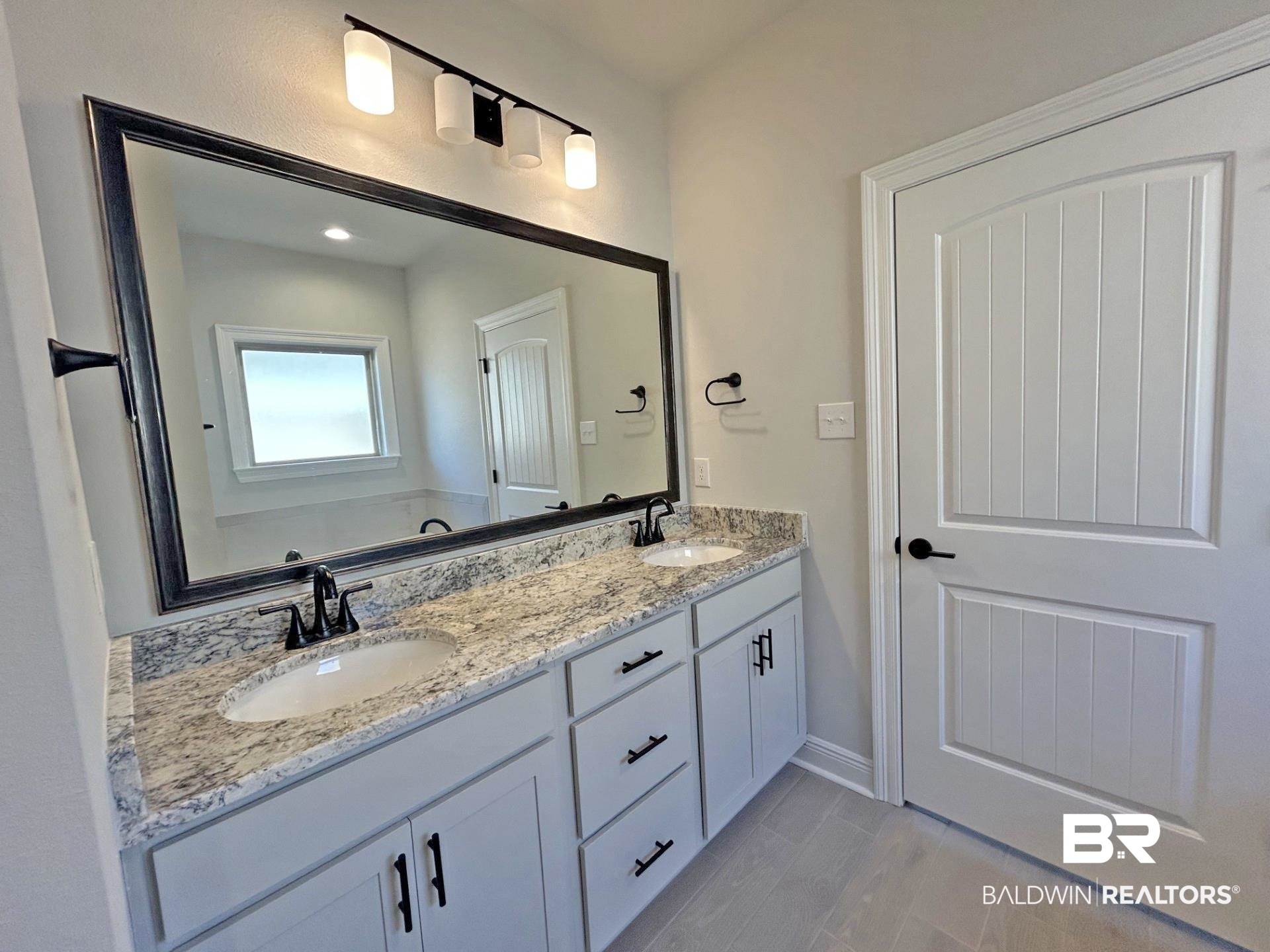1748 Breckinridge Place Foley, AL 36535 - Photo 15 of 25 Bathroom with double vanity and wood tiled floors