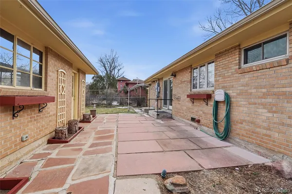a view of a backyard with sitting area