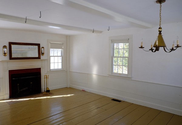 269 Russell Hill Road Ashburnham, MA 01430 - Photo 8 of 25 a view of an empty room with window and wooden floor