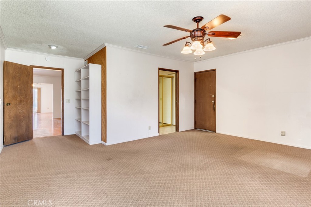 9130 Duncan Avenue Riverside, CA 92503 - Photo 14 of 34 a view of an empty room with a ceiling fan
