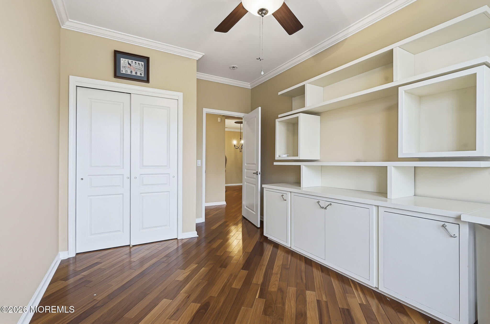 106 Potts Road Morganville, NJ 07751 - Photo 15 of 25 a view of a kitchen with wooden floor and a ceiling fan