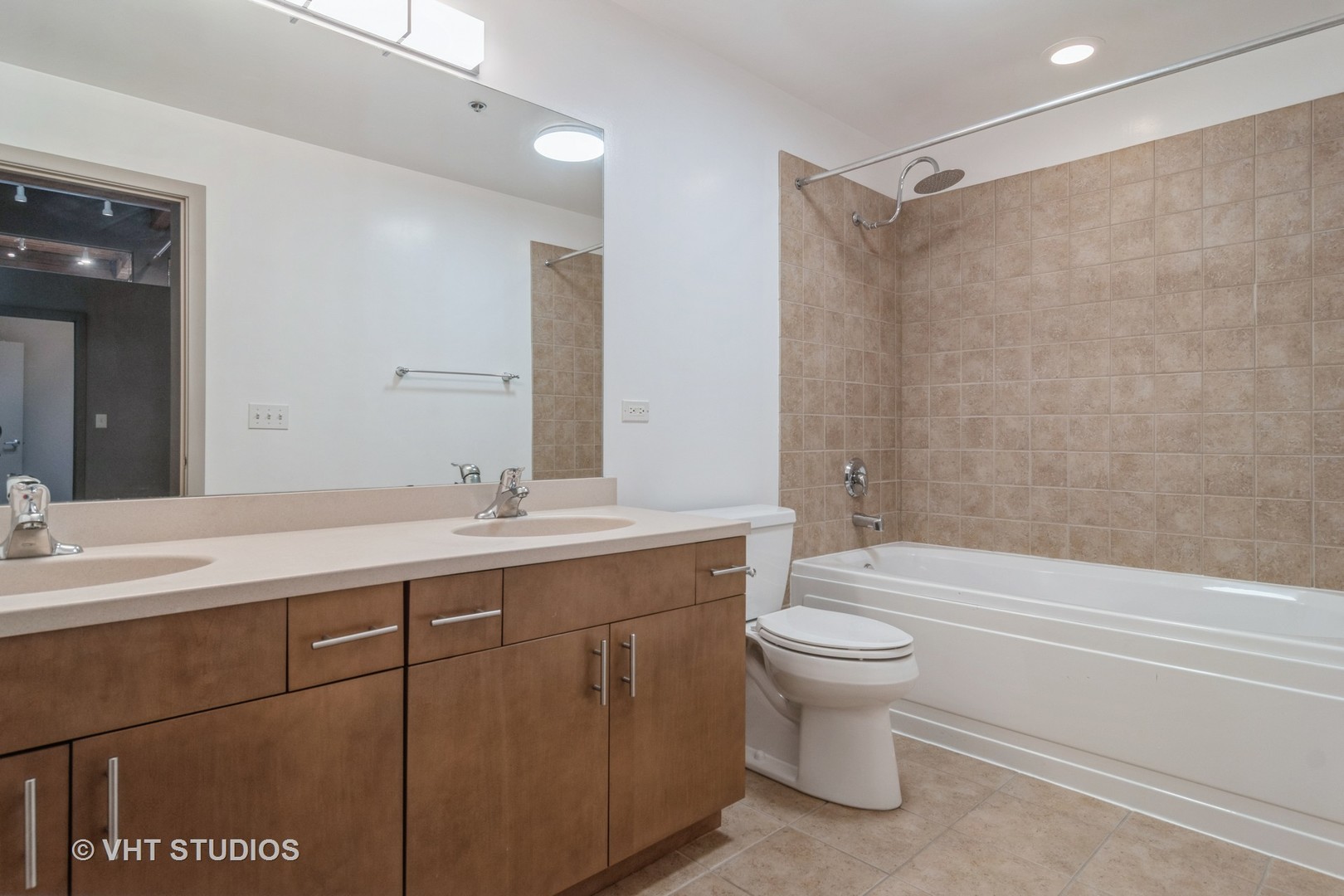 1040 West Adams Street, Unit 608 Chicago, IL 60607 - Photo 15 of 24 a bathroom with a sink a toilet and shower