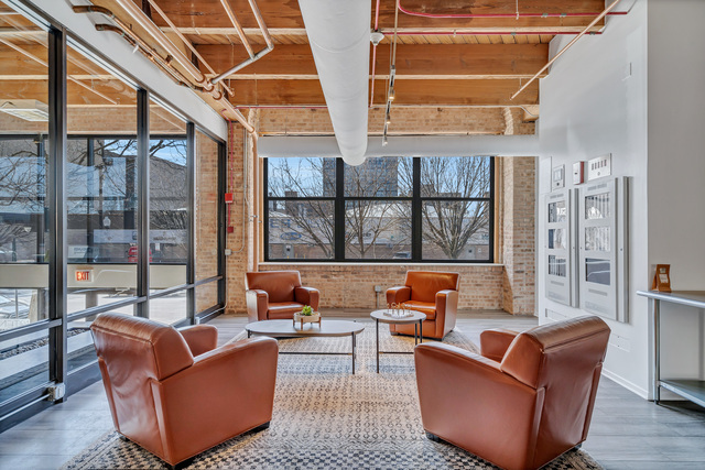 1040 West Adams Street, Unit 608 Chicago, IL 60607 - Photo 6 of 24 a outdoor living space with patio furniture and wooden floor