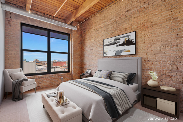 1040 West Adams Street, Unit 608 Chicago, IL 60607 - Photo 10 of 24 a bedroom with a bed couch and window