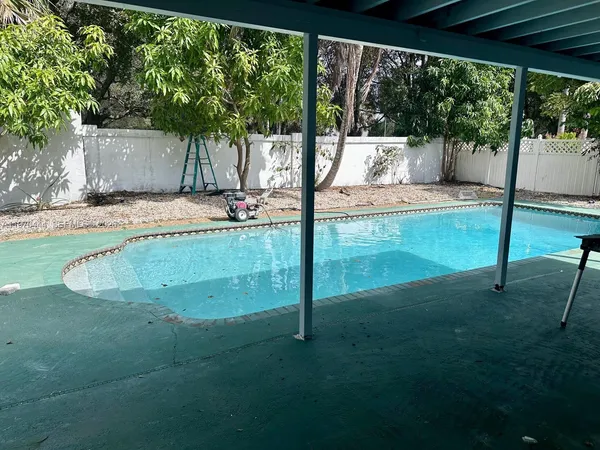 a view of a small yard and deck