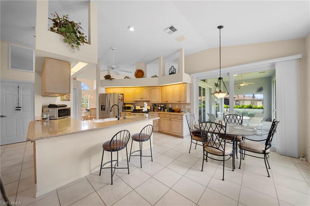 3971 Spring Garden Lane Estero, FL 33928 - Photo 3 of 31 a outdoor space with lots of furniture and a chandelier