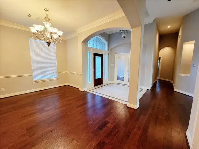 a view of a livingroom with wooden floor