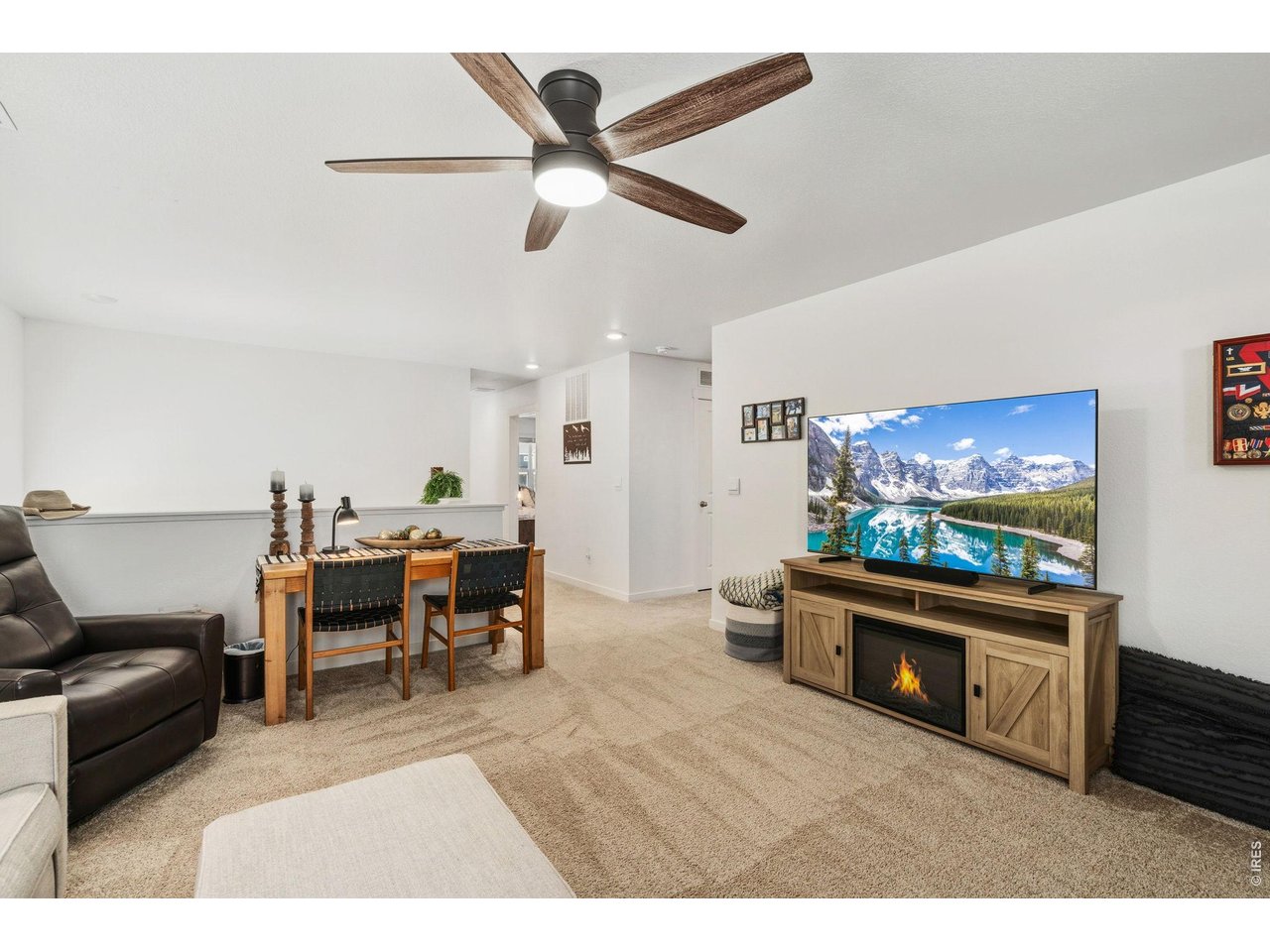 438 Bluebird Road Johnstown, CO 80534 - Photo 19 of 33 Upstairs loft with TV console and natural light - an additional living zone.