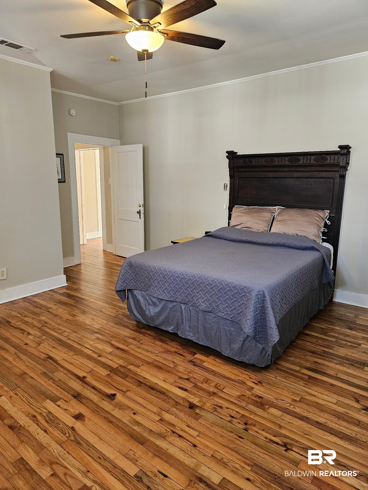 1215 Church Street Mobile, AL 36604 - Photo 14 of 23 Bedroom with visible vents, crown molding, baseboards, and wood finished floors