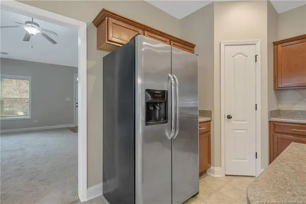 a bathroom with a glass shower door and a sink