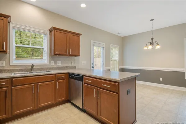 a kitchen with sink cabinets and window