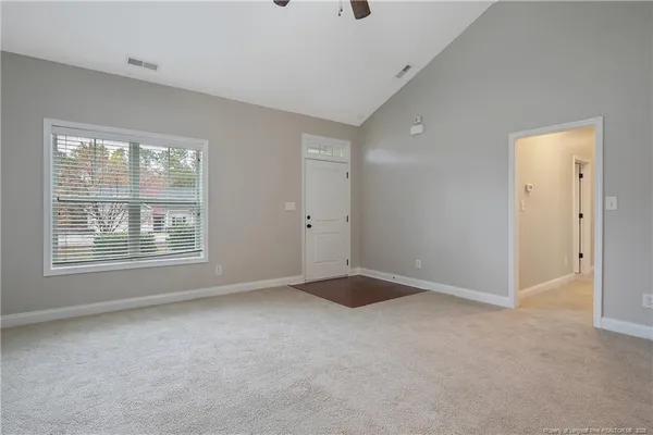 a view of an empty room with a window