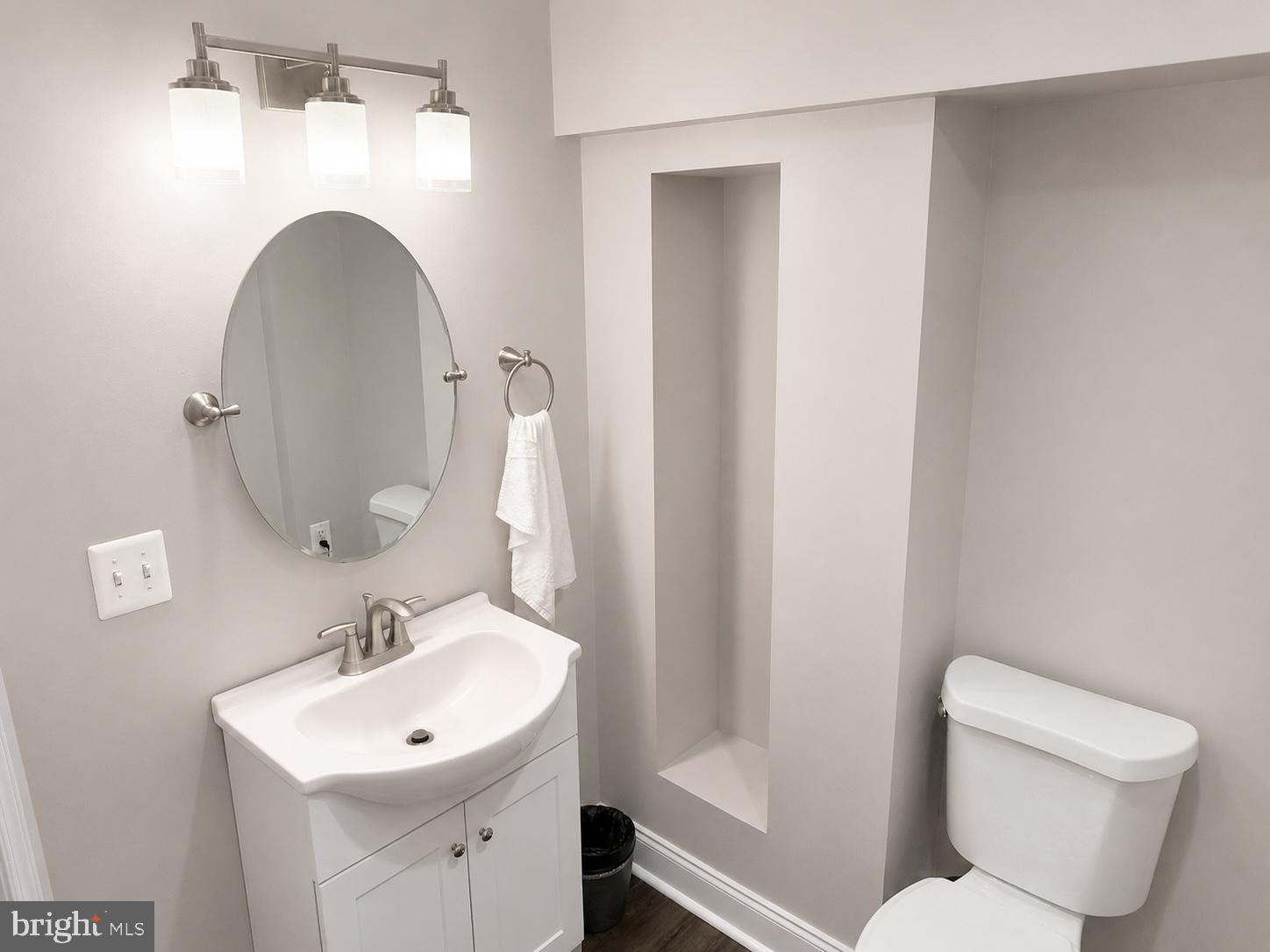 2235 Southorn Road Baltimore, MD 21220 - Photo 26 of 33 a bathroom with a toilet sink and mirror