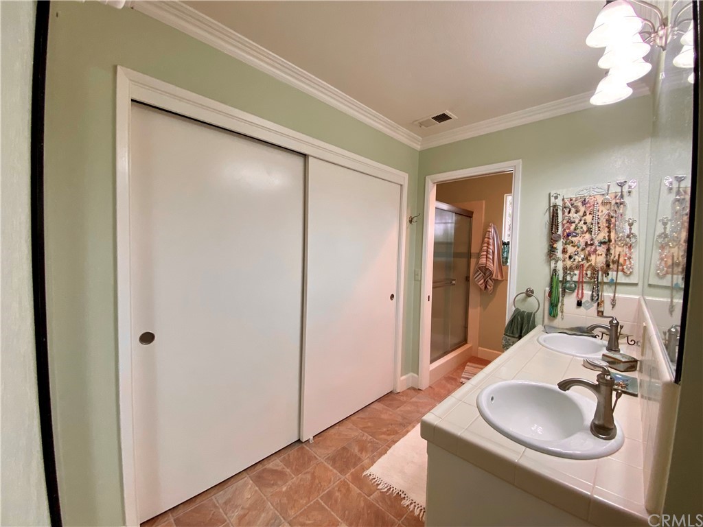 7605 San Gregorio Road Atascadero, CA 93422 - Photo 14 of 22 a bathroom with a sink and a mirror