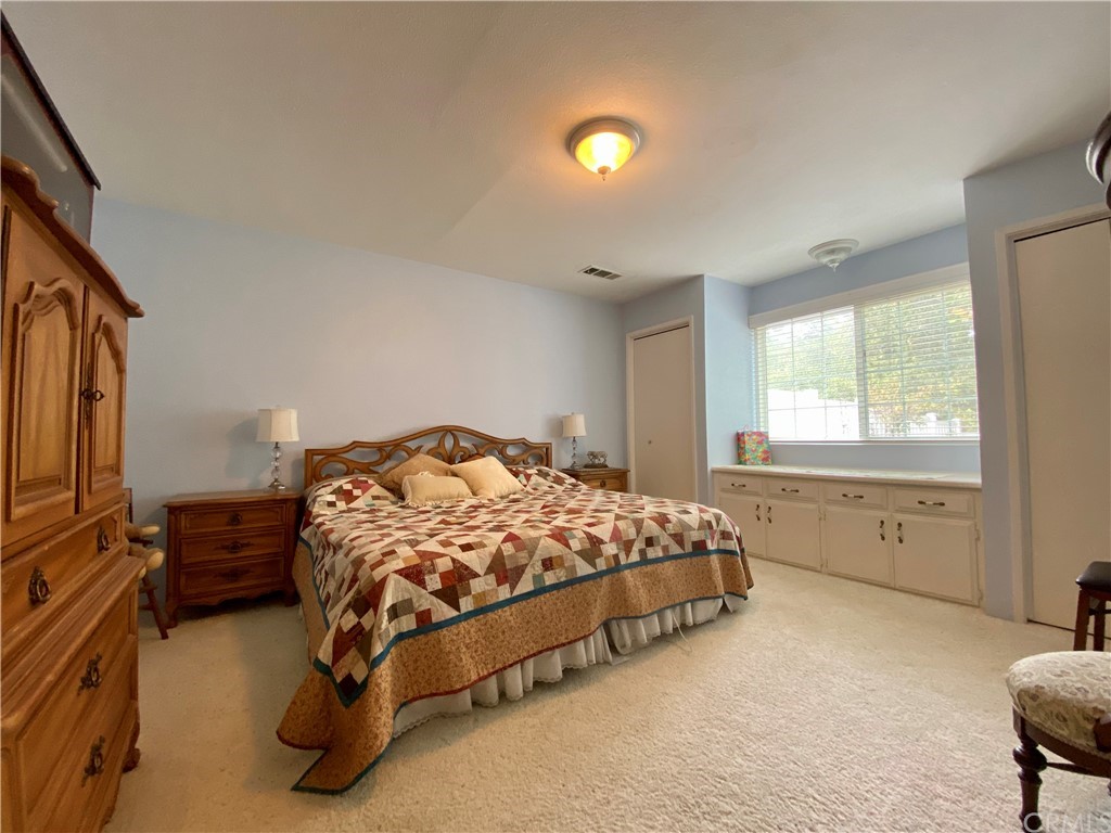 7605 San Gregorio Road Atascadero, CA 93422 - Photo 15 of 22 a bedroom with a bed and a window